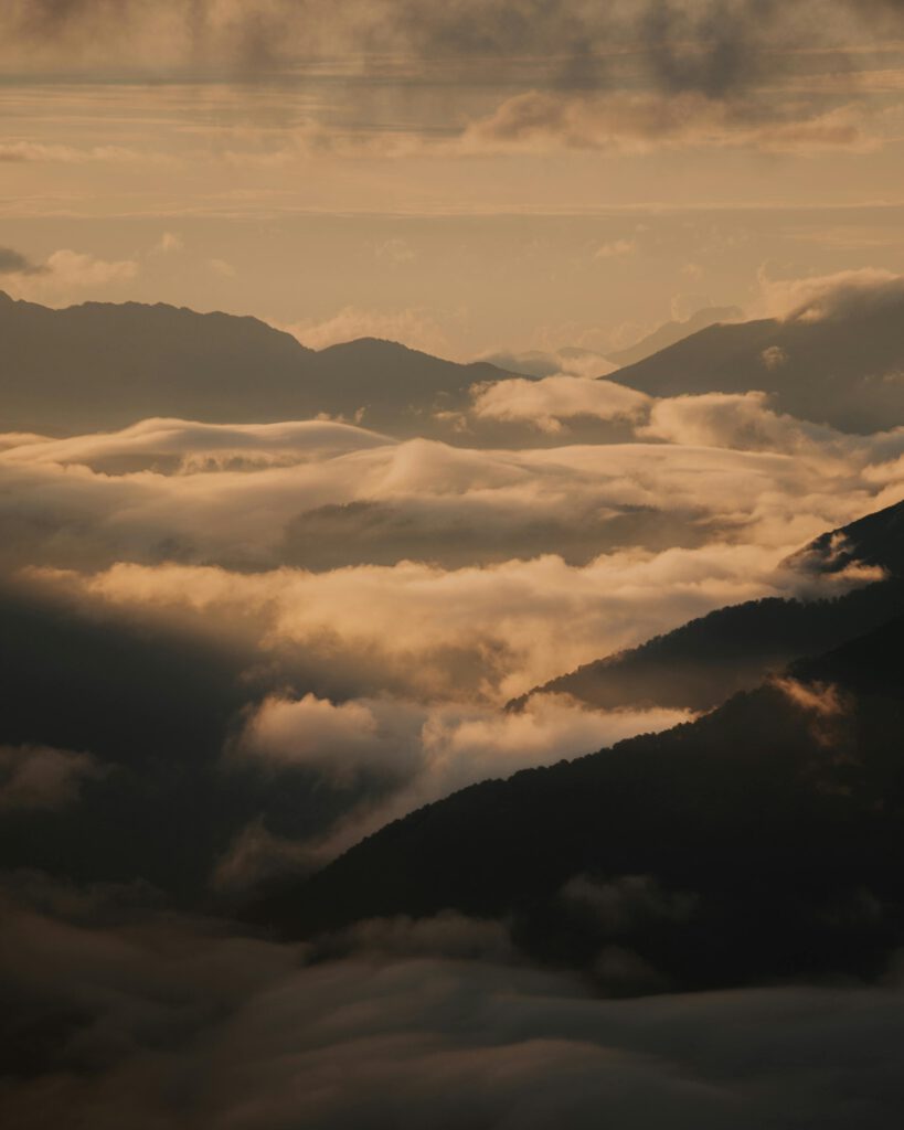 A breathtaking view of Sochi's cloud-covered mountains during daytime, showcasing nature's beauty.